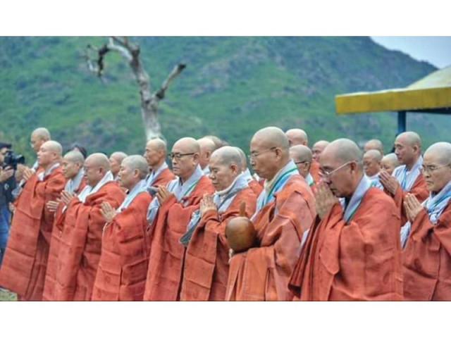 buddhist monks from korea perform a ritual at a historical site in haripur photo express buddhist monks from korea perform a ritual at a historical site in haripur photo express