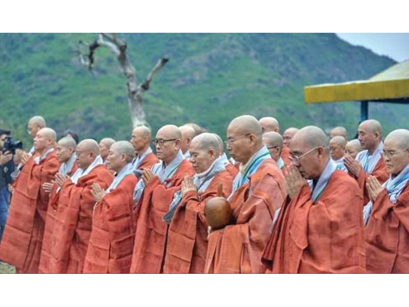 buddhist monks from korea perform a ritual at a historical site in haripur photo express