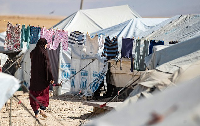 this photo shows a woman walking among tents at the kurdish run al hol camp for the displaced where families of islamic state is foreign fighters are held photo afp this photo shows a woman walking among tents at the kurdish run al hol camp for the displaced where families of islamic state is foreign fighters are held photo afp
