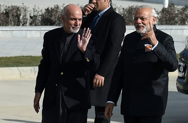 indian prime minister narendra modi right and afghan president ashraf ghani arrive for a ribbon cutting ceremony at the inauguration of afghanistan 039 s new parliament in december 2015 photo afp