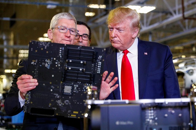 apple ceo tim cook escorts u s president donald trump as he tours apple 039 s mac pro manufacturing plant with treasury secretary steven mnuchin looking on in austin texas us november 20 2019 photo reuters