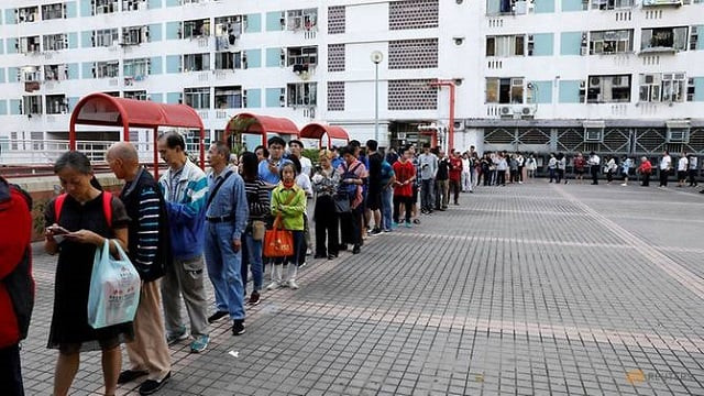 voters queue outside a polling station during district council local elections in hong kong china november 24 2019 photo reuters voters queue outside a polling station during district council local elections in hong kong china november 24 2019 photo reuters