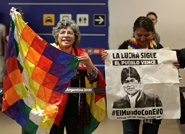 bolivian citizens living in argentina wait at the buenos aires airport for the arrival of former bolivian president evo morales 039 s children evaliz and alvaro they were granted political asylum in argentina photo afp bolivian citizens living in argentina wait at the buenos aires airport for the arrival of former bolivian president evo morales 039 s children evaliz and alvaro they were granted political asylum in argentina photo afp