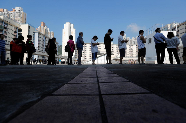 voters queue at a polling station during district council local elections in hong kong china november 24 2019 photo reuters