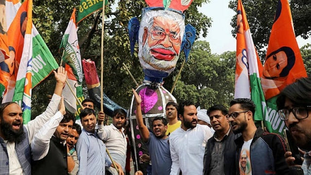 supporters of india s main opposition congress party shout slogans and hold an effigy depicting india s prime minister narendra modi at a protest against the formation of a bharatiya janata party bjp led coalition government in maharashtra in new delhi india photo afp supporters of india s main opposition congress party shout slogans and hold an effigy depicting india s prime minister narendra modi at a protest against the formation of a bharatiya janata party bjp led coalition government in maharashtra in new delhi india photo afp