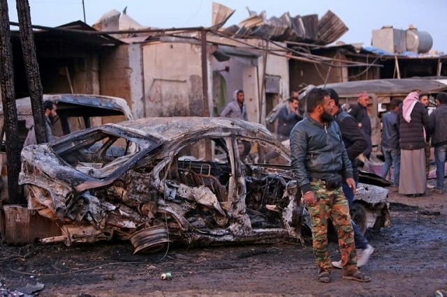 several vehicles were reduced to charred shells by the blast at a local market in the village photo afp several vehicles were reduced to charred shells by the blast at a local market in the village photo afp