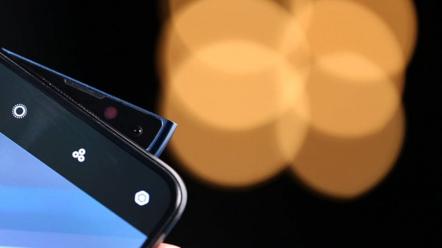 the glossy finish that is curved at both the sides is what enhances the beauty of the phone photo express the glossy finish that is curved at both the sides is what enhances the beauty of the phone photo express