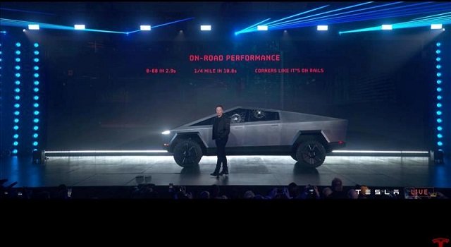 tesla chief executive elon musk stands in front of the company 039 s first electric pickup truck the cybertruck after it was unveiled in los angeles california us november 21 2019 in this frame grab made from the livestream of the unveiling event photo reuters