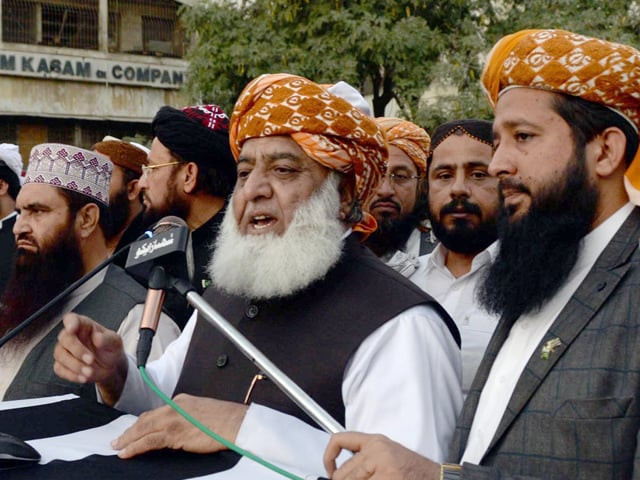 jui f chief maulana fazl addresses a protest rally outside ecp office in karachi photo inp