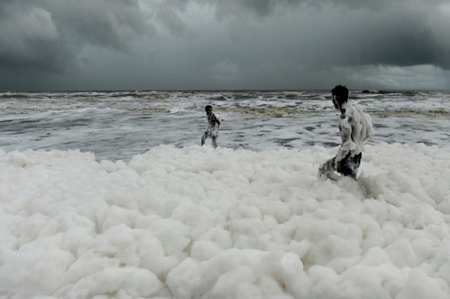 children have been playing and taking selfies in the clouds of white suds on marina beach even though they give off an acrid smell and fishermen have been told not to go into the sea nearby photo afp