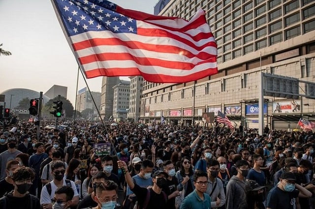 people take part in a march from the tsim sha tsui district to hung hom in hong kong photo afp people take part in a march from the tsim sha tsui district to hung hom in hong kong photo afp