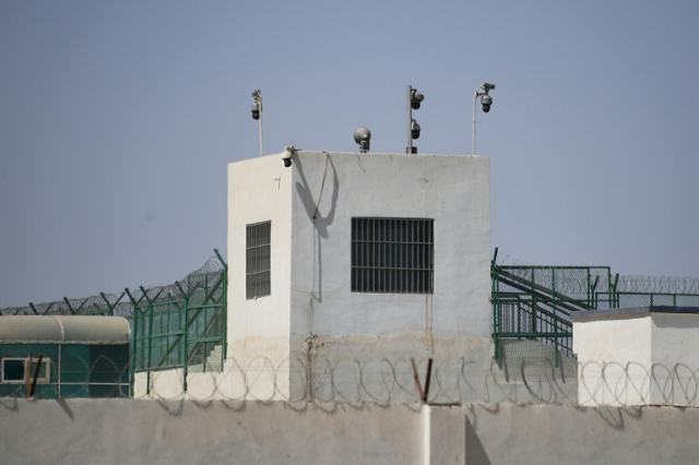the outer wall of a complex that includes what is believed to be a re education camp where mostly muslim ethnic minorities are detained in xinjiang photo afp the outer wall of a complex that includes what is believed to be a re education camp where mostly muslim ethnic minorities are detained in xinjiang photo afp