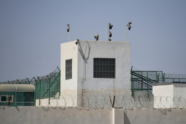 the outer wall of a complex that includes what is believed to be a re education camp where mostly muslim ethnic minorities are detained in xinjiang photo afp