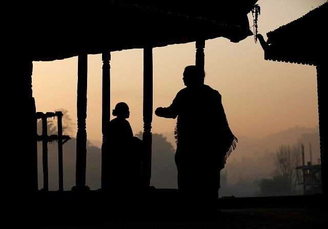 women are silhouetted as they offer daily prayers at a temple in bhaktapur nepal in december 2016 photo reuters women are silhouetted as they offer daily prayers at a temple in bhaktapur nepal in december 2016 photo reuters