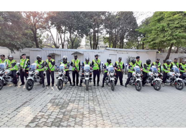 shaheen squad personnel pose with their bikes photo express shaheen squad personnel pose with their bikes photo express