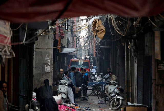 a fire engine is seen at the site of a fire that swept through a factory where laborers were sleeping in new delhi india december 8 2019 photo reuters