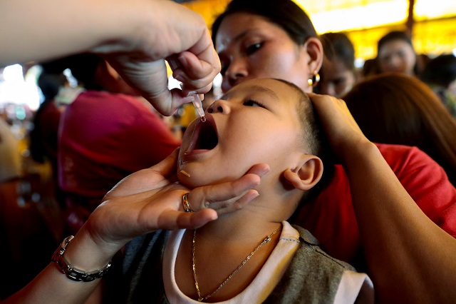 a child receives free polio vaccine during a government led mass vaccination program in quezon city metro manila philippines october 14 2019 photo reuters file