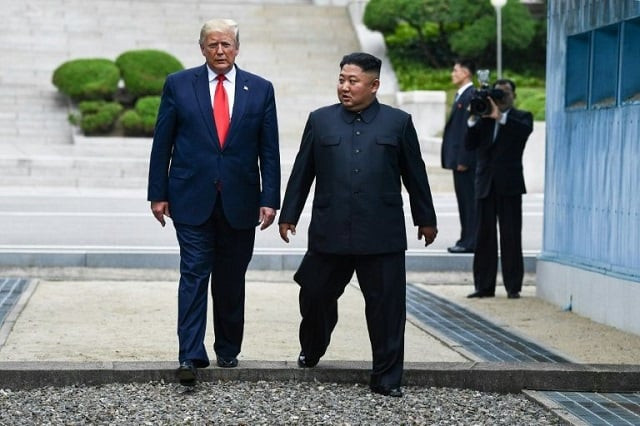 north korea 039 s leader kim jong un and us president donald trump cross south of the military demarcation line that divides north and south korea after trump briefly stepped over to the northern side on june 30 2019 photo afp north korea 039 s leader kim jong un and us president donald trump cross south of the military demarcation line that divides north and south korea after trump briefly stepped over to the northern side on june 30 2019 photo afp