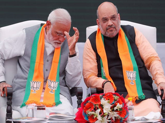 indian prime minister narendra modi sitting with indian home minister amit shah during an event in new delhi india photo reuters indian prime minister narendra modi sitting with indian home minister amit shah during an event in new delhi india photo reuters