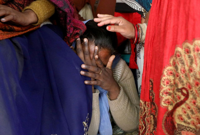 a relative of a 23 year old rape victim who died in a new delhi hospital on friday after she was set on fire by a gang of men photo reuters