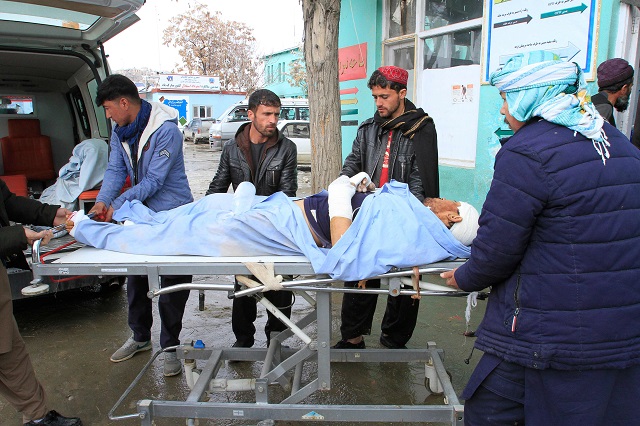 a wounded man is brought to a hospital after a vehicle was hit by a roadside bomb in ghazni photo afp