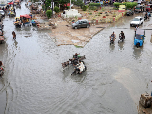 nagan chowrangi in north nazimabad is flooded after light rain on sunday photo online nagan chowrangi in north nazimabad is flooded after light rain on sunday photo online