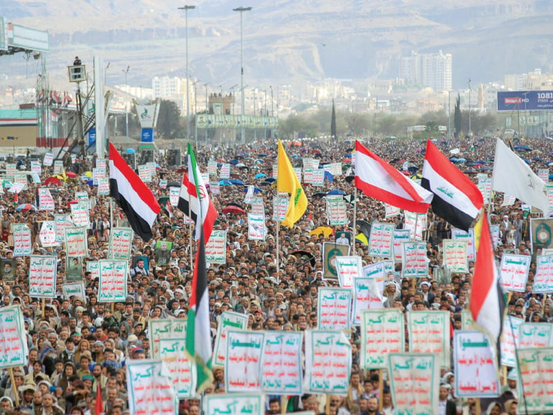 yemenis lift placards during a demonstration in sanaa photo afp