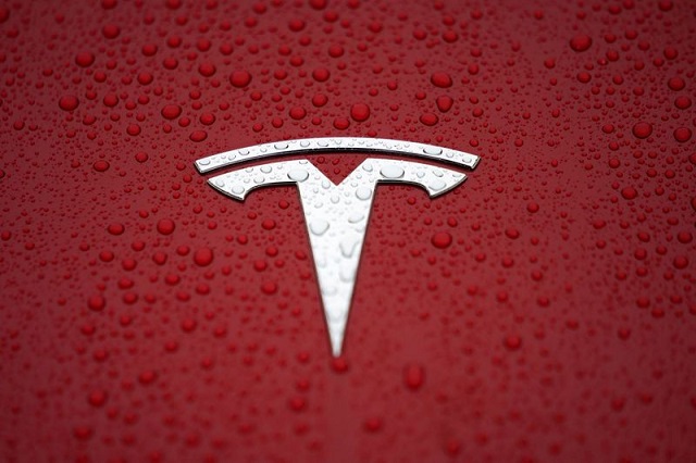 a tesla logo is seen at a groundbreaking ceremony of tesla shanghai gigafactory in shanghai china january 7 2019 photo reuters