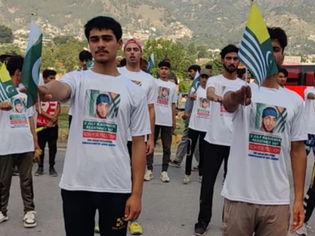 young kashmiris hold pakistan and azad jammu and kashmir flags at a rally commemorating burhan wani photo express young kashmiris hold pakistan and azad jammu and kashmir flags at a rally commemorating burhan wani photo express