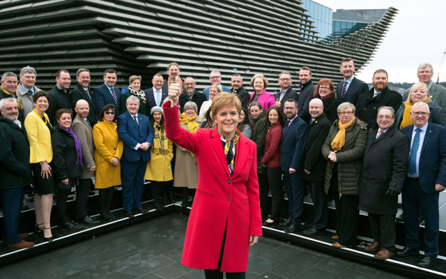 scottish national party snp leader and scotland 039 s first minister nicola sturgeon poses with snp 039 s newly elected mps during a photo call outside the v amp a museum in dundee scotland on december 14 2019 photo afp