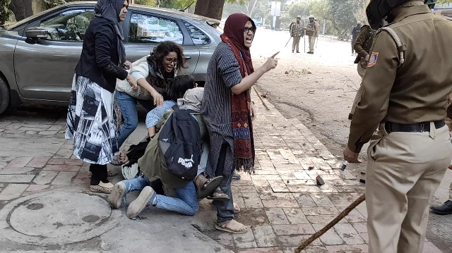 women form a human shield around a man beaten by police during protests against new citizenship law at jamia millia islamia university in new delhi december 15 2019 in this screen grab obtained from a social media video photo reuters women form a human shield around a man beaten by police during protests against new citizenship law at jamia millia islamia university in new delhi december 15 2019 in this screen grab obtained from a social media video photo reuters