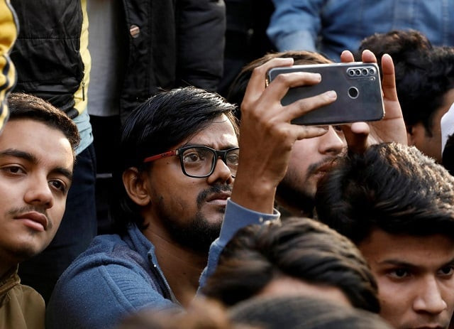 abdul rehman a student of jamia millia islamia university uses his mobile phone to shoot video which he later posted on social media such as instagram at the venue of a protest against a new citizenship law outside the university in new delhi india december 18 2019 photo reuters abdul rehman a student of jamia millia islamia university uses his mobile phone to shoot video which he later posted on social media such as instagram at the venue of a protest against a new citizenship law outside the university in new delhi india december 18 2019 photo reuters