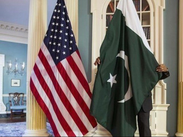 a state department contractor adjust a pakistan national flag before a meeting at the state department in washington photo reuters