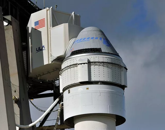 the boeing cst 100 starliner spacecraft atop a ula atlas v rocket stands at launch complex 40 at the cape canaveral air force station in cape canaveral florida december 19 2019 photo reuters