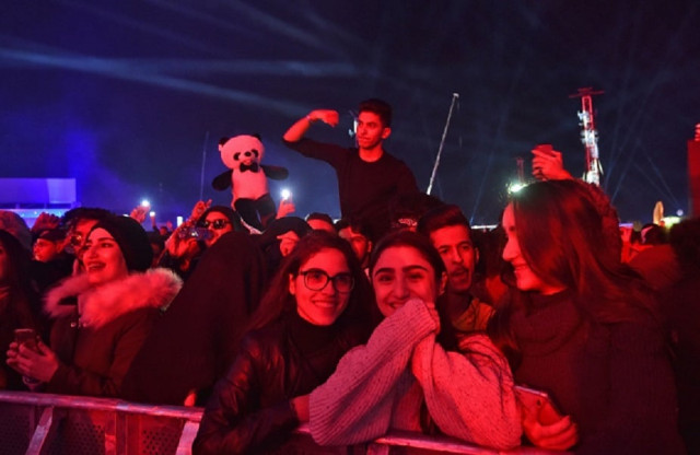 the multi stage festival attracted 130 000 fans on its first day say organisers of the three day event photo afp
