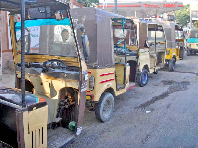 rickshaws queue up on the road outside a closed cng station in the provincial capital the supply of cng has been suspended here since tuesday disrupting public transport in the city photo online