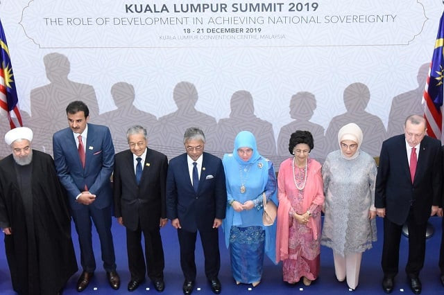iranian president hassan rouhani qatar 039 s emir sheikh tamim bin among other leaders pose for photograph during malaysia summit photo reuters file iranian president hassan rouhani qatar 039 s emir sheikh tamim bin among other leaders pose for photograph during malaysia summit photo reuters file
