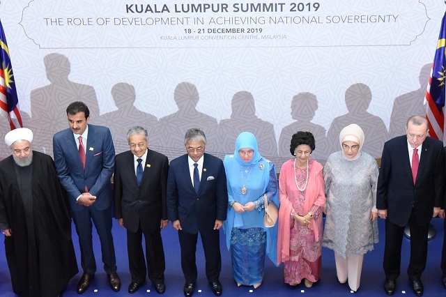 iranian president hassan rouhani qatar 039 s emir sheikh tamim bin among other leaders pose for photograph during malaysia summit photo reuters file