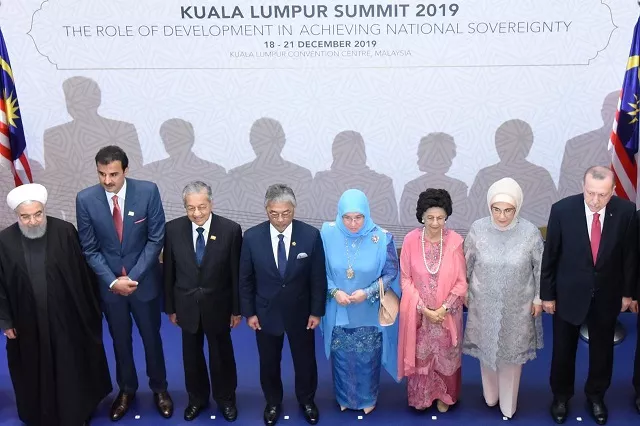 iranian president hassan rouhani qatar 039 s emir sheikh tamim bin among other leaders pose for photograph during malaysia summit photo reuters file iranian president hassan rouhani qatar 039 s emir sheikh tamim bin among other leaders pose for photograph during malaysia summit photo reuters file