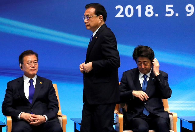 japan 039 s prime minister shinzo abe south korea 039 s president moon jae in and china 039 s premier li keqiang attend the 6th japan china korea business summit in tokyo photo reuters