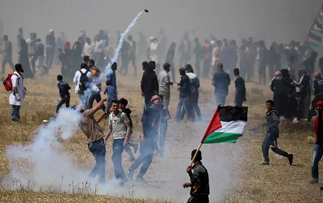 a palestinian demonstrator hurls back a tear gas canister fired by israeli forces during a protest photo reuters a palestinian demonstrator hurls back a tear gas canister fired by israeli forces during a protest photo reuters