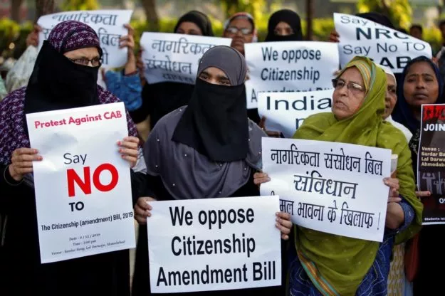 demonstrators display placards during a protest against the citizenship amendment bill photo reuters demonstrators display placards during a protest against the citizenship amendment bill photo reuters