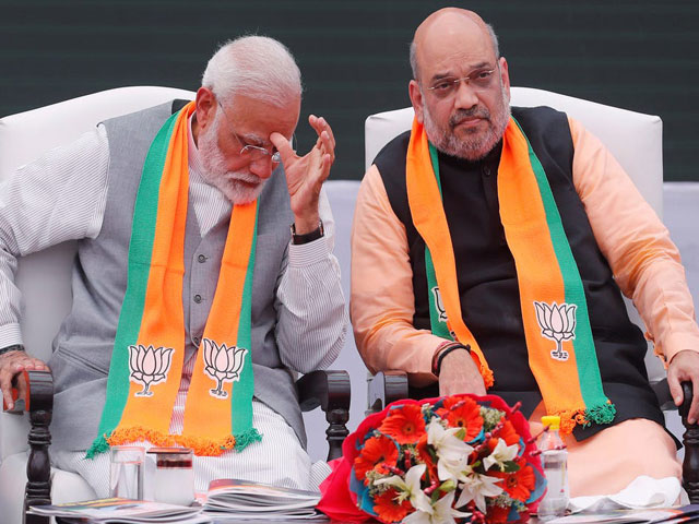 indian prime minister narendra modi sitting with indian home minister amit shah during an event in new delhi india photo reuters