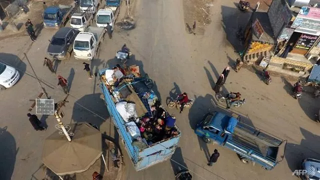 syrian families flee the village of hazano about 20km northwest of the city of idlib towards the turkish border after the regime stepped up advances against militants photo afp syrian families flee the village of hazano about 20km northwest of the city of idlib towards the turkish border after the regime stepped up advances against militants photo afp