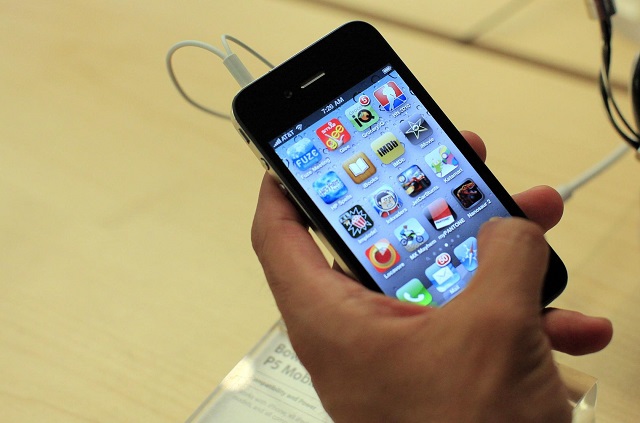 a customer looks at an iphone 4 at the apple store 5th avenue in new york in this june 24 2010 photo reuters