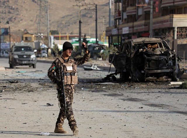 a member of the afghan security forces keeps watch at the site of a suicide blast in kabul afghanistan in november photo reuters