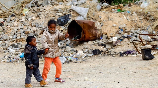 in central tripoli the grey skeletons of a highrise construction site    abandoned since 2008 due to a property dispute    now host more than 170 families photo afp