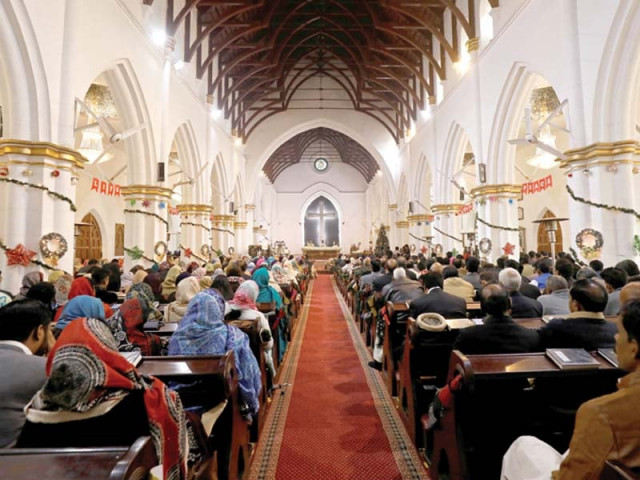 people attend a christmas day service at st john s cathedral in peshawar photo reuters people attend a christmas day service at st john s cathedral in peshawar photo reuters