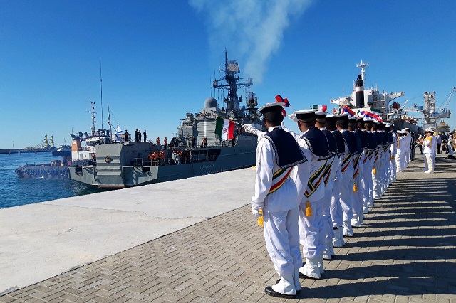 a handout photo shows iranian seamen saluting the russian navy neustrashimyy class frigate quot yaroslav mudry quot while moored at chabahar on the gulf of oman photo afp