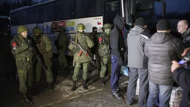 ukrainian servicemen who were made prisoners wait during a prisoner exchange between ukraine and pro russia rebels on the check point near the city of gorlivka photo afp ukrainian servicemen who were made prisoners wait during a prisoner exchange between ukraine and pro russia rebels on the check point near the city of gorlivka photo afp